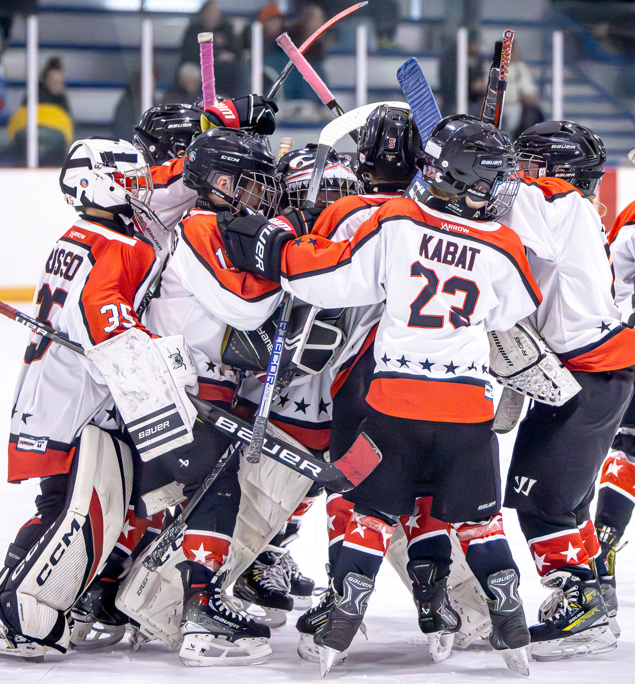 Syracuse Galaxy youth hockey team posing on the ice